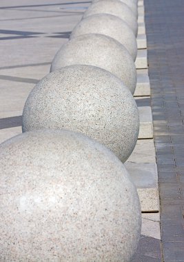 Architectural details in form of balls. Image with shallow depth of field. clipart