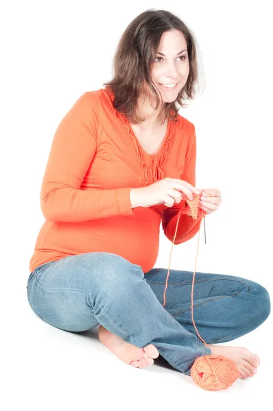 stock image Portrait of pretty pregnant woman knitting