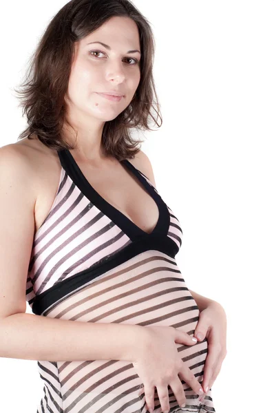 Kobieta w ciąży ręce w formie serca znak — Zdjęcie stockowe
