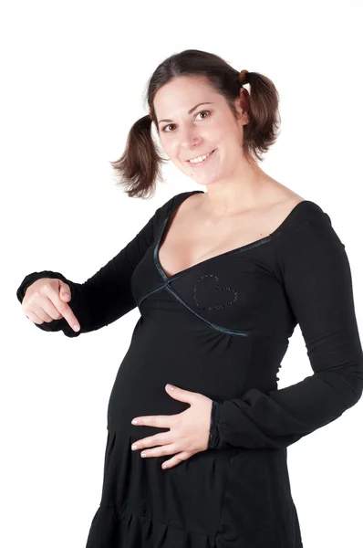 Portret bardzo ciąży kobieta w czarnej sukni — Zdjęcie stockowe