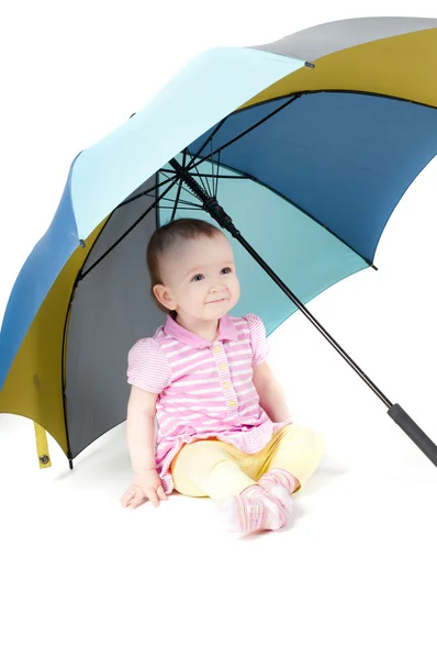 stock image Shot of cute baby girl sitting uner umbrella