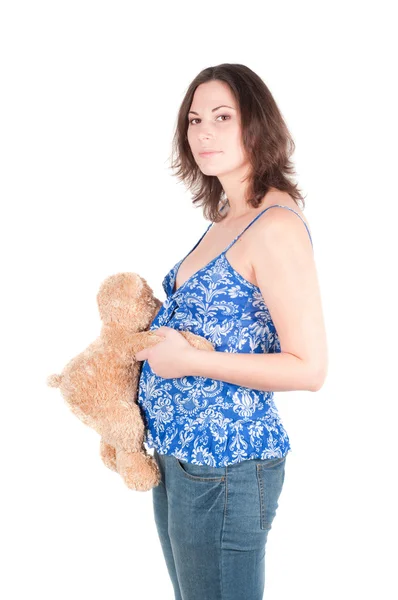 Портрет красивой беременной женщины с игрушкой — стоковое фото