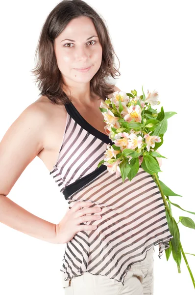 Portrét docela těhotné ženy s květinami — Stock fotografie