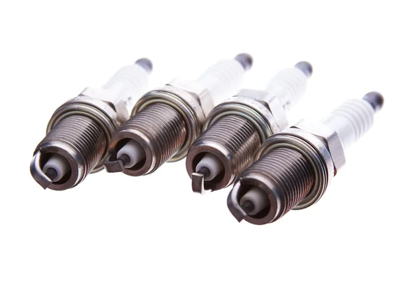 Four spark plugs — Stock Photo, Image