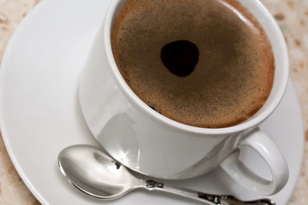 Taza de café en la mesa — Foto de Stock