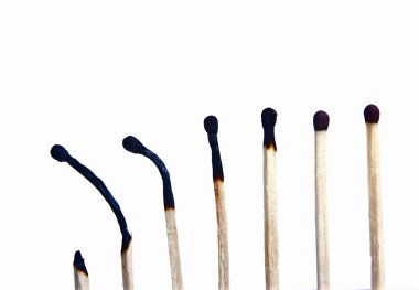 Group of burned and unburned matches, isolated on white background clipart