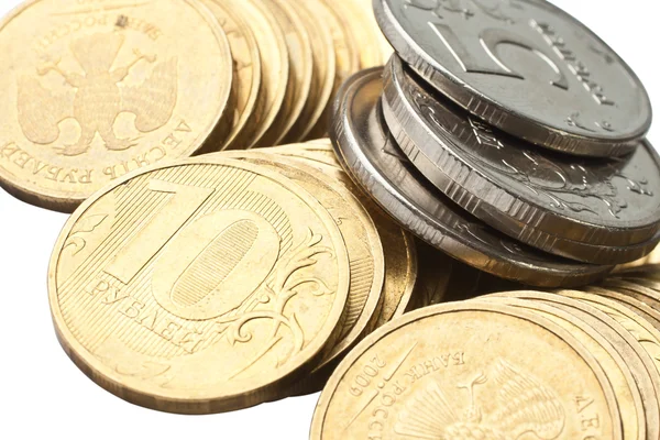 Monedas de oro y plata sobre fondo blanco — Foto de Stock