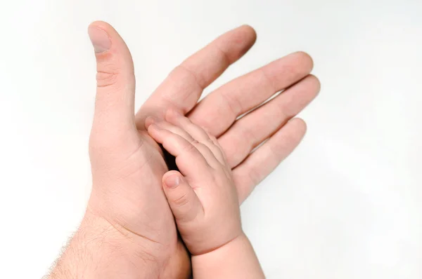 Мужская и детская рука — стоковое фото