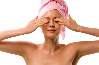 Beautiful young woman after washing with a towel over your head clipart