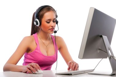 Pretty girl works on a computer clipart