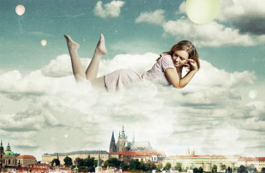 Beauty woman near the clouds clipart