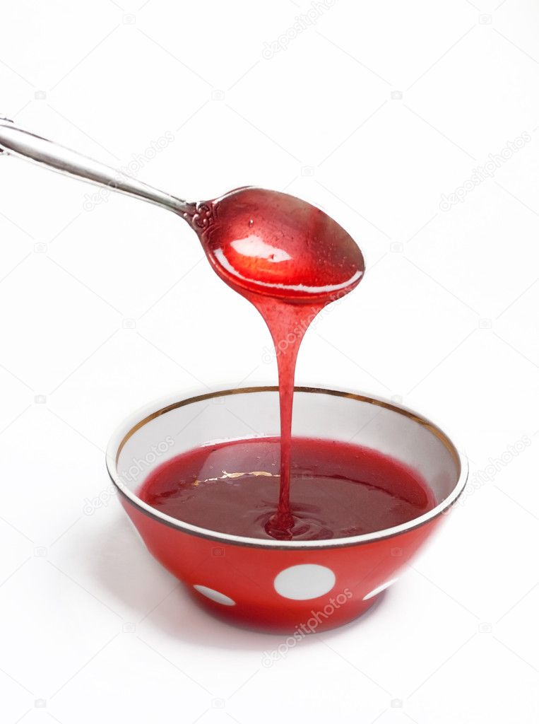 Berry jam in a red saucer