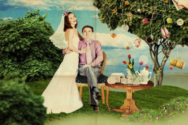 Happy couple in wedding day in park clipart