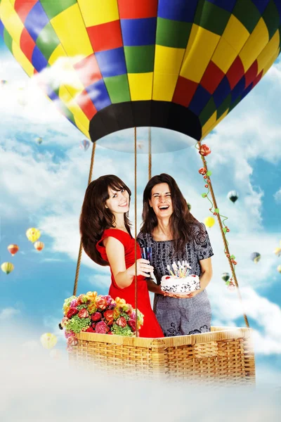 Beauty girls on air balloon in the sky — Stock Photo, Image