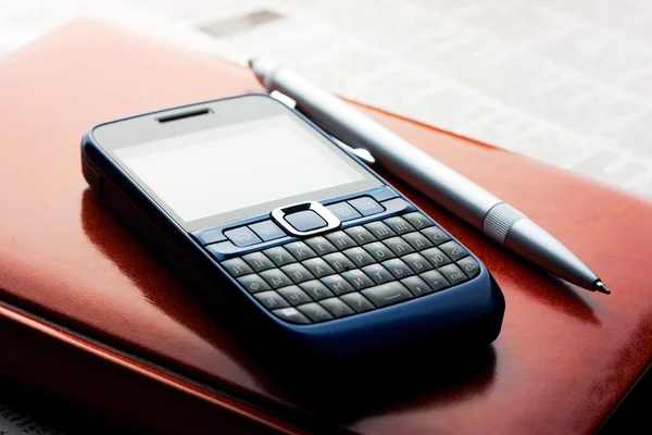 stock image Phone lying on the diary