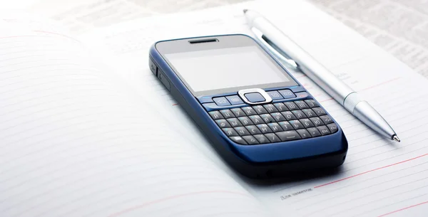 stock image Phone lying on the diary