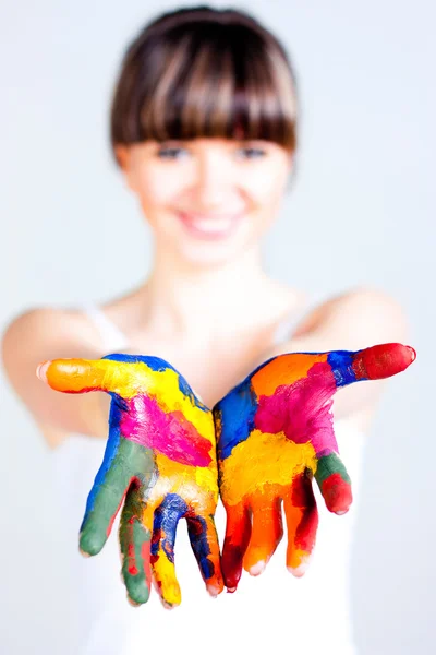 A girl with colored hands Stock Photo