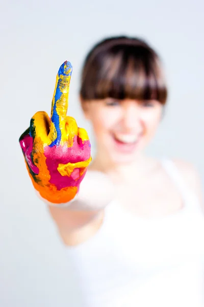 En flicka med färgade händer Stockfoto