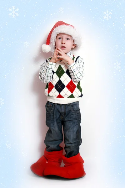 Chlapec s klobouk santa, úsměv — Stock fotografie