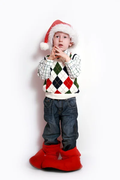 Noel Baba şapkası, çocuk gülümseyen — Stok fotoğraf