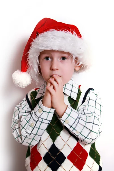 Ragazzo con cappello da Babbo Natale, sorridente — Foto Stock