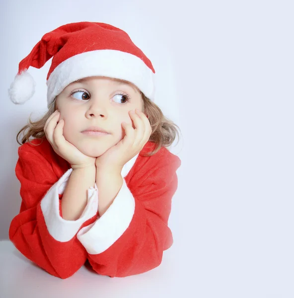 Little girl in Santa's hat — Stock Photo, Image