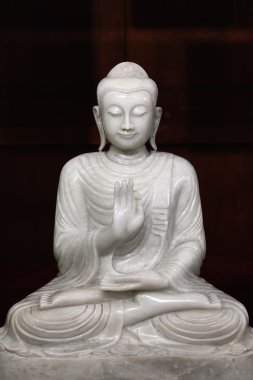 Sitting Buddha statue in temple. clipart