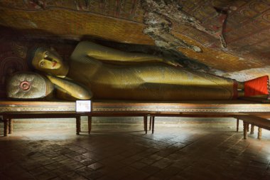 Ancient Buddha image in Dambulla Rock Temple caves, Sri Lanka clipart