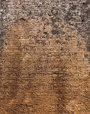 Ancient stone inscriptions in Singalese language texture. clipart