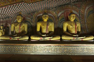 Ancient Buddha imageы in Dambulla Rock Temple caves, Sri Lanka clipart