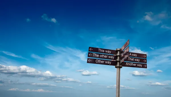 Signpost in sky — Stock Photo, Image