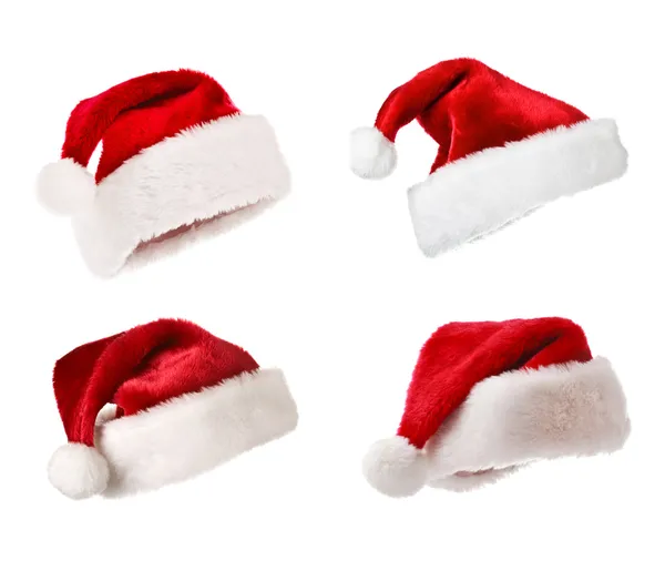 Weihnachtsmannhüte isoliert auf weiß — Stockfoto