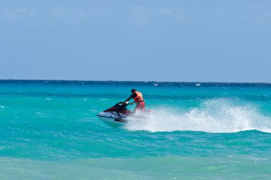 Man riding jet ski clipart