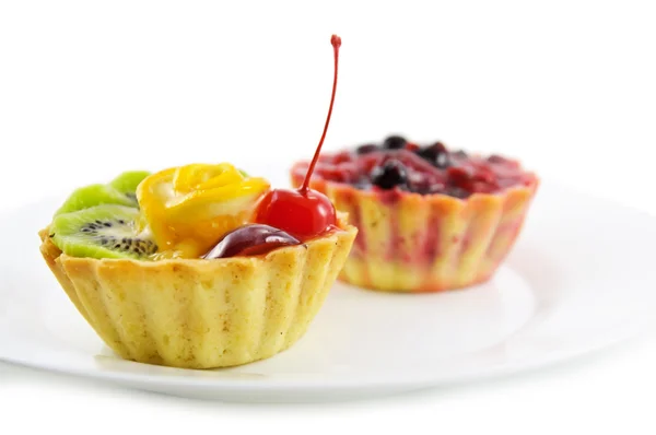 stock image Two cupcakes with fruits and berry, on the white