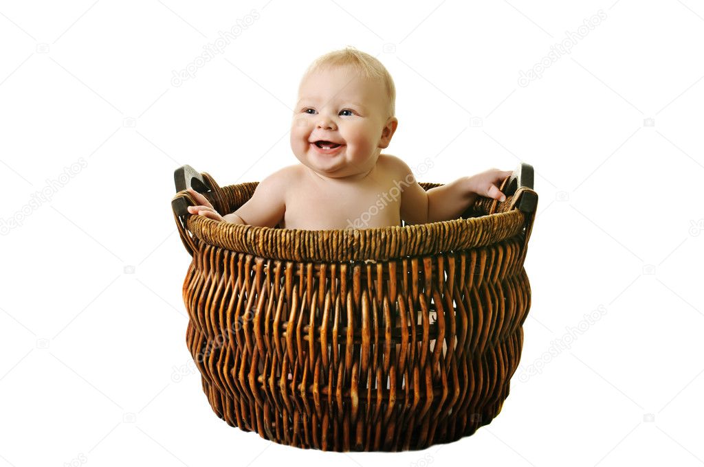 Little girl in the basket on white background