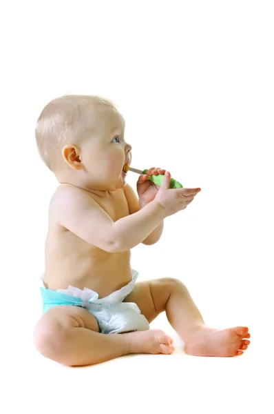 Little baby girl with teething brush — Stock Photo, Image