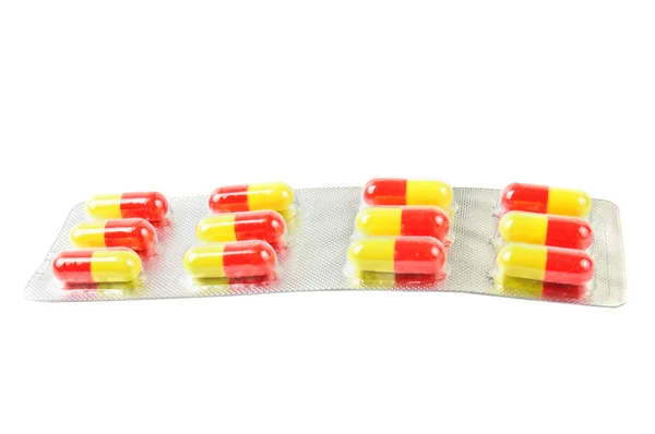 Pakket met geel-rood pillen t — Stockfoto