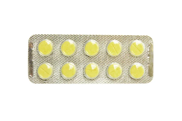 Package with yellow tablets — Stock Photo, Image