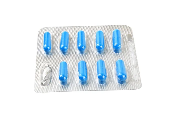 Пакет с голубыми таблетками — стоковое фото