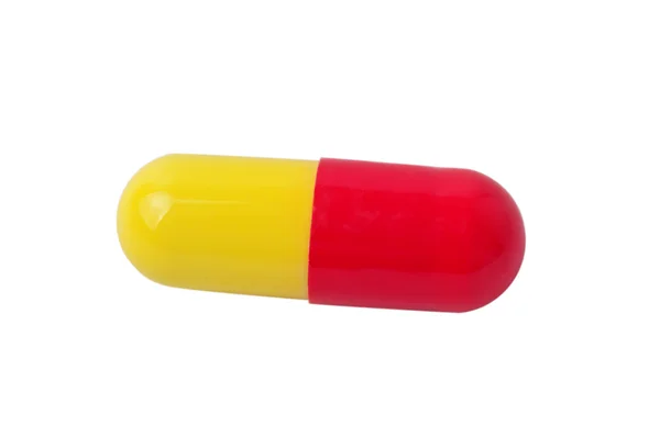 Jedna pilulka lékařské červeno žlutá — Stock fotografie