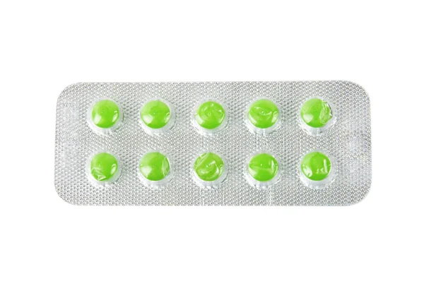 Package with green tablets — Stock Photo, Image