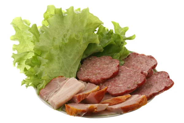 Meat, sausage and salad leaves — Stock Photo, Image