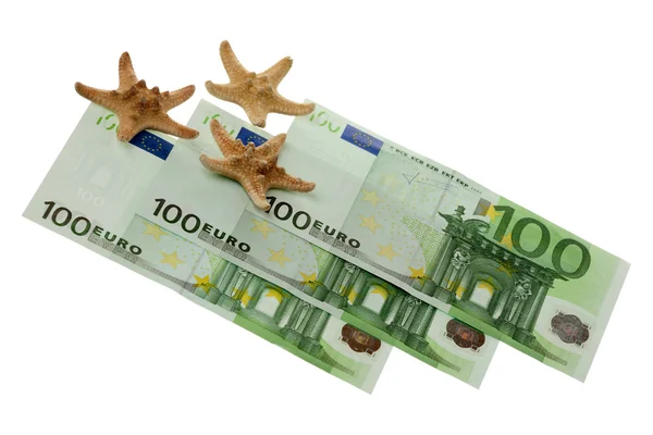 Starfishes and euro — Stock Photo, Image