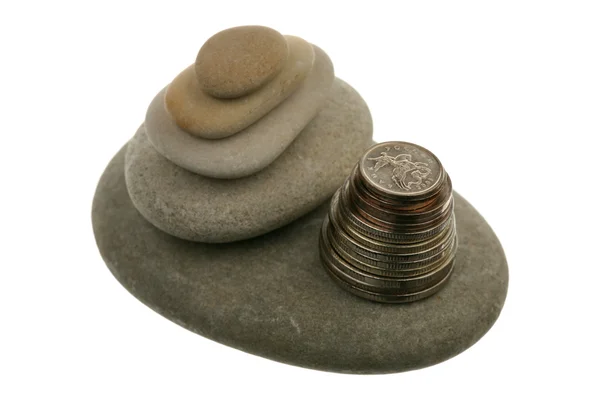 Pile of stones and coins — Stock Photo, Image