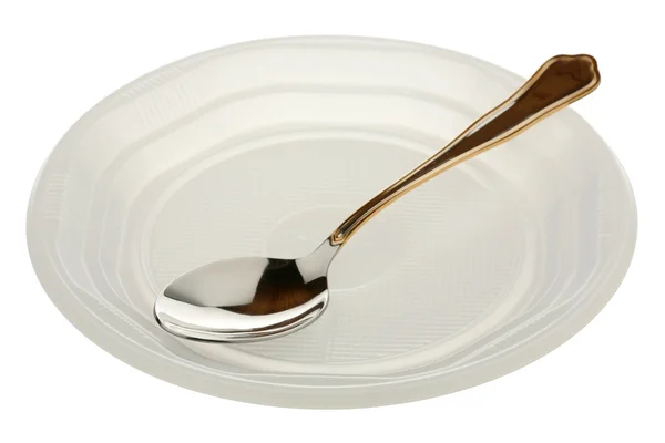 Μεταλλικό κουτάλι σε ένα πλαστικό πιάτο — Φωτογραφία Αρχείου