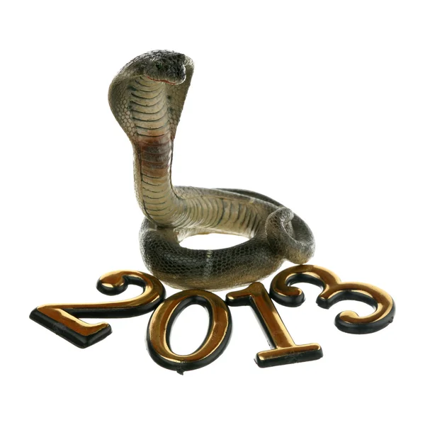 2013 年数和一条玩具蛇隔离在白色背景上 — 图库照片