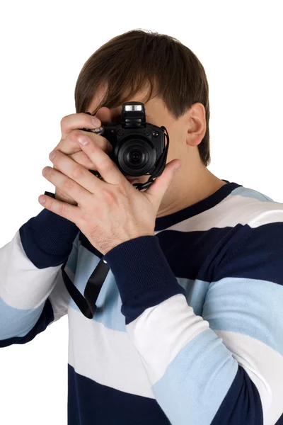 Νεαρός άνδρας με μια φωτογραφική μηχανή. απομονωθεί σε λευκό — Φωτογραφία Αρχείου