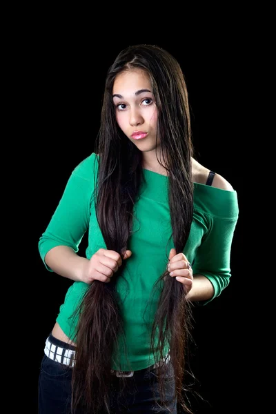 Playful Young Woman Holding Her Long Hair Isolated — Stock Photo, Image