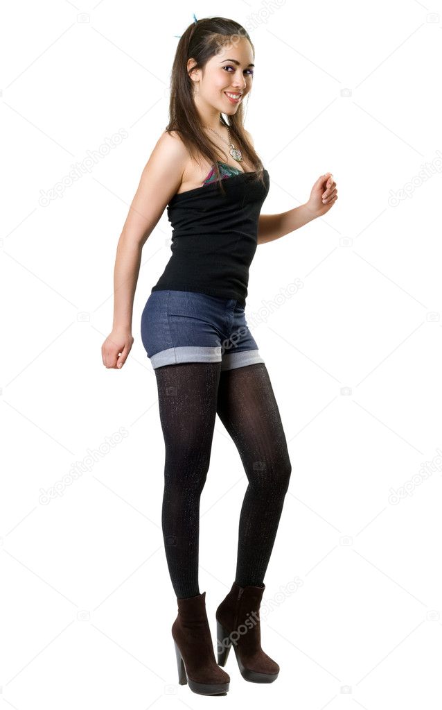 Playful young woman wearing fashion clothes. Isolated