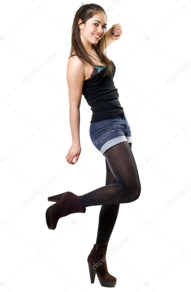 Playful young woman hopping on one leg. Isolated